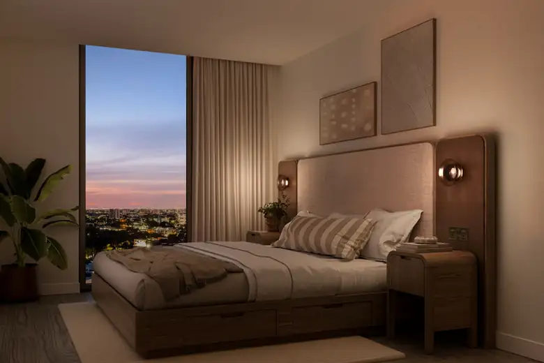 Quarto de um flat do Domus ao entardecer, com janelas do piso ao teto